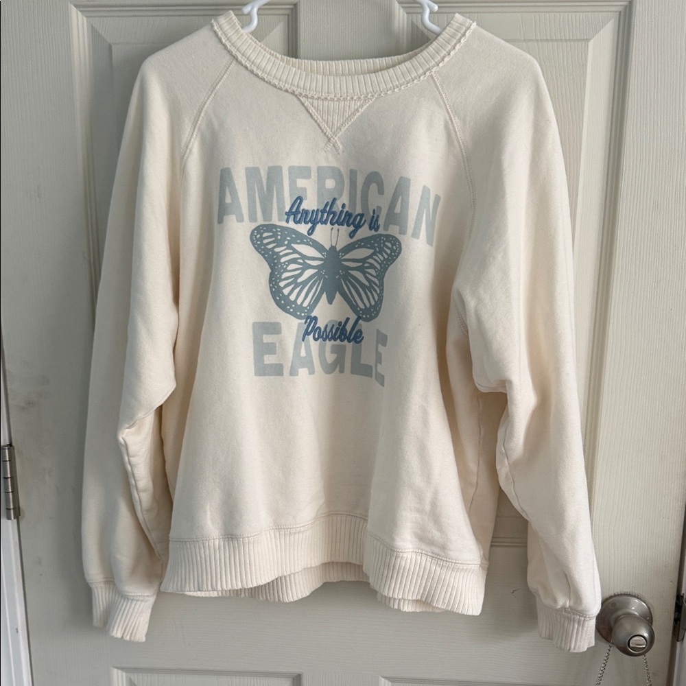 American Eagle Outfitters Cream Sweater with Blue Butterfly Graphic